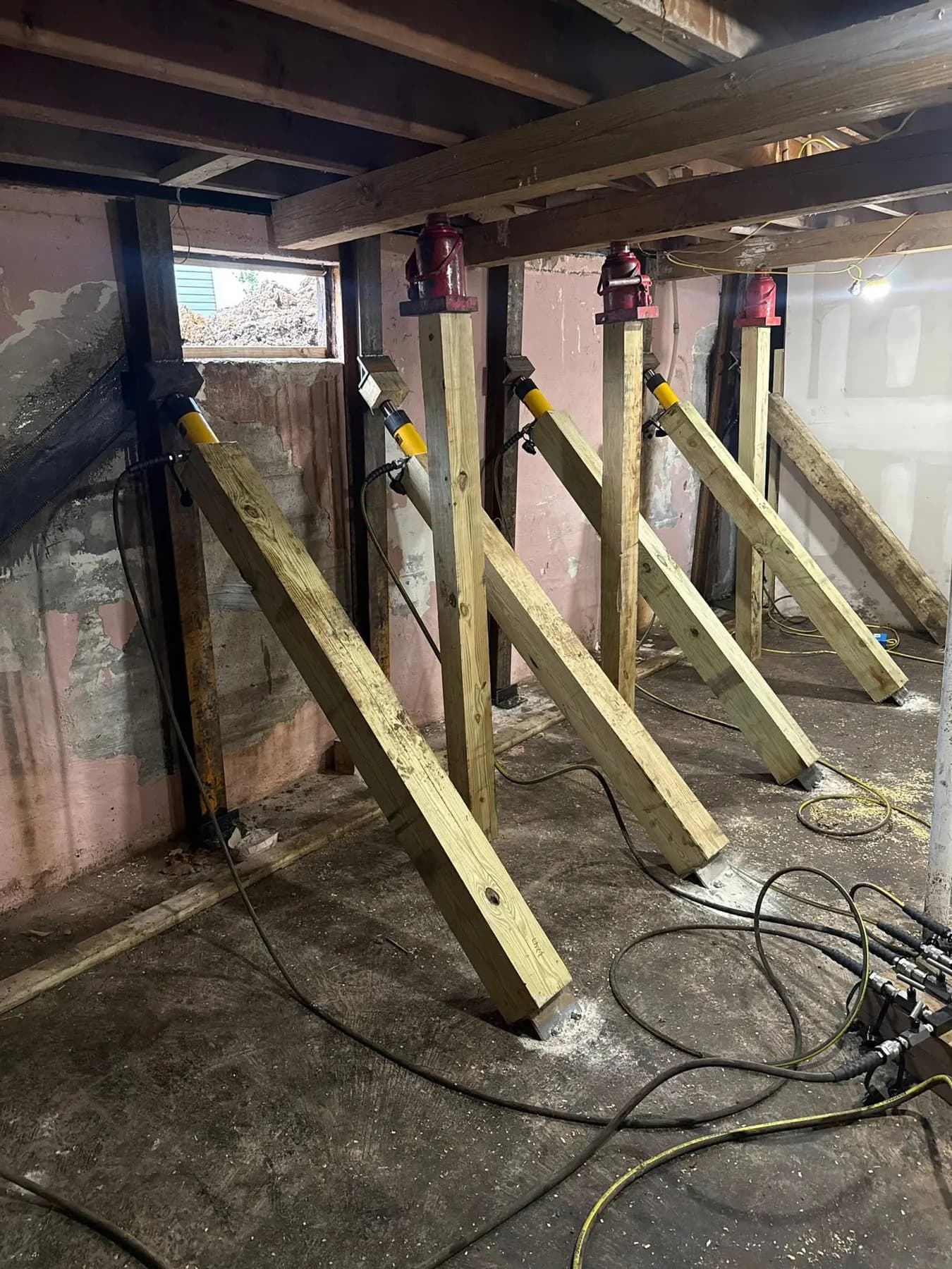 Temporary shoring supporting a basement wall